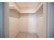 Walk-in closet with shelving, rods for hanging and neutral carpeting at 3823 S Maryland Pkwy # L6, Las Vegas, NV 89119