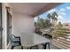 Relaxing balcony with patio furniture and views of the surrounding landscape and blue skies at 4555 E Sahara Ave # 280, Las Vegas, NV 89104
