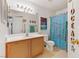 Charming bathroom featuring a seashell shower curtain, large mirror and beach themed decor to make you 'relax' at 4555 E Sahara Ave # 280, Las Vegas, NV 89104