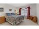 Cozy bedroom with carpet, window, and wooden furniture, creating a comfortable and inviting space at 4555 E Sahara Ave # 280, Las Vegas, NV 89104