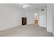 A simple bedroom with neutral carpet, white walls, and minimal furnishings, offering a blank canvas at 4555 E Sahara Ave # 280, Las Vegas, NV 89104