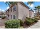 Attractive condo featuring well-maintained landscaping, stucco walls, and private balconies, complemented by mature palm trees at 4555 E Sahara Ave # 280, Las Vegas, NV 89104