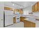 Compact kitchen layout featuring practical appliances and plenty of cabinet space, optimized for efficiency at 4555 E Sahara Ave # 280, Las Vegas, NV 89104