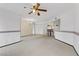 Open-concept living space with adjoining kitchen area, featuring neutral carpet and bright lighting at 4555 E Sahara Ave # 280, Las Vegas, NV 89104