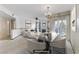Staged living and dining room features contemporary furnishings and a fireplace, perfect for modern living at 4555 E Sahara Ave # 280, Las Vegas, NV 89104