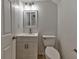 Powder room featuring a light wood vanity with a modern faucet and mirror at 53 Blue Beak Way, Henderson, NV 89012