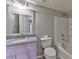 Bathroom vanity and shower/tub combo with gray countertop and white tiling at 53 Blue Beak Way, Henderson, NV 89012