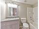 Well-lit bathroom featuring a light-colored vanity and a shower-tub combo at 53 Blue Beak Way, Henderson, NV 89012