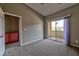 Bedroom featuring carpet, a ceiling fan and a balcony with sliding door at 53 Blue Beak Way, Henderson, NV 89012