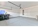 This garage features epoxy flooring and white walls at 53 Blue Beak Way, Henderson, NV 89012