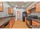 Bright kitchen featuring wood floors, granite countertops, and stainless steel appliances at 53 Blue Beak Way, Henderson, NV 89012