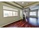 Inviting living room with hardwood floors, large windows, and neutral decor at 53 Blue Beak Way, Henderson, NV 89012