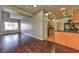 Bright living space with hardwood floors, flowing seamlessly into the kitchen at 53 Blue Beak Way, Henderson, NV 89012