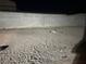 Backyard shows gravel landscaping enclosed with a cinder block fence at 533 Calypso Dr, Henderson, NV 89002