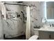 Renovated bathroom featuring a modern glass shower, marble tile walls and updated fixtures at 533 Calypso Dr, Henderson, NV 89002