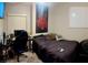 Bedroom shows a gaming setup, a bed and window for a cozy feel at 533 Calypso Dr, Henderson, NV 89002