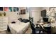 Bedroom view showcases an artistic setup with a bed, desk, dresser, and artwork at 533 Calypso Dr, Henderson, NV 89002