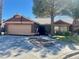 Charming single-story home with tile roof, two-car garage, and well-maintained landscaping at 533 Calypso Dr, Henderson, NV 89002