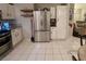 Well-equipped kitchen featuring stainless steel appliances and adjacent cozy living space at 533 Calypso Dr, Henderson, NV 89002