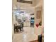Well-lit kitchen features white cabinets, stainless steel appliances, and a cozy breakfast nook at 533 Calypso Dr, Henderson, NV 89002