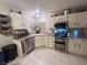 Bright kitchen with stainless steel appliances and ample counter space offers functionality at 533 Calypso Dr, Henderson, NV 89002