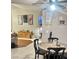 Open-concept living area with fireplace and dining set offers both relaxation and dining convenience at 533 Calypso Dr, Henderson, NV 89002