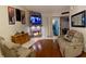 Inviting living room with stone fireplace and hardwood floors offers a cozy and stylish space at 533 Calypso Dr, Henderson, NV 89002