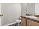 Powder bathroom featuring a wood vanity, tile floors, and neutral paint at 5382 Runningbrook Rd, Las Vegas, NV 89120