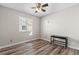 Bedroom features wood-look floors and natural light at 5382 Runningbrook Rd, Las Vegas, NV 89120