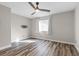 Bedroom with ceiling fan, luxury vinyl plank floors, and neutral paint at 5382 Runningbrook Rd, Las Vegas, NV 89120