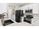 Modern kitchen with gas range, updated appliances, and stylish countertops at 5382 Runningbrook Rd, Las Vegas, NV 89120