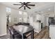 Open-concept living and kitchen area with high ceilings, updated appliances, and modern flooring at 5382 Runningbrook Rd, Las Vegas, NV 89120