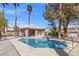Community pool features covered seating and lounge chairs at 5382 Runningbrook Rd, Las Vegas, NV 89120