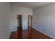 Bedroom with glossy hardwood floors and doors to the closet and bathroom at 5461 Dungaree St, Las Vegas, NV 89118