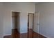 Bedroom featuring glossy wood floors with doors to the closet and bathroom at 5461 Dungaree St, Las Vegas, NV 89118