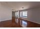 Bright bedroom boasts wood floors, neutral walls, and closet with mirror doors at 5461 Dungaree St, Las Vegas, NV 89118