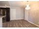 Dining area with wood-look flooring features chandelier and convenient access to kitchen at 5461 Dungaree St, Las Vegas, NV 89118