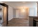 Spacious dining area showcases attractive chandelier, wood-look floors, and neutral paint at 5461 Dungaree St, Las Vegas, NV 89118