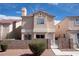 Charming two-story home featuring a well-maintained yard and a secure gated entrance for added privacy at 5461 Dungaree St, Las Vegas, NV 89118