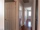 The hallway is well-lit with doors leading to various rooms and hardwood floors at 5461 Dungaree St, Las Vegas, NV 89118