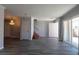 Open living space showcasing gray floors, stairs, and a dining area with a decorative chandelier at 5461 Dungaree St, Las Vegas, NV 89118