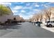 Street view showcasing a well-maintained neighborhood with lined trees and sidewalks at 5461 Dungaree St, Las Vegas, NV 89118