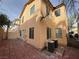 A cozy backyard patio area with brick pavers and modern cooling units, perfect for outdoor relaxation at 5661 Bonds Flat St, Las Vegas, NV 89148