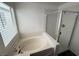 Well-lit bathroom showcases a soaking tub with a separate glass enclosed shower at 5661 Bonds Flat St, Las Vegas, NV 89148