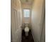 Small half bathroom shows a new toilet, a window with blinds, and light walls at 5661 Bonds Flat St, Las Vegas, NV 89148