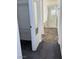 Hallway leading to a full bathroom, with tub and shower, and access to a walk-in closet at 5661 Bonds Flat St, Las Vegas, NV 89148
