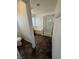 Bright bathroom featuring dark tile floors, a combined tub and shower and a functional layout at 5661 Bonds Flat St, Las Vegas, NV 89148