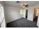 Bright bedroom features a ceiling fan, window, and neutral walls, offering a serene space at 5661 Bonds Flat St, Las Vegas, NV 89148