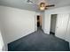 Bedroom with gray carpet, ceiling fan and closet at 5661 Bonds Flat St, Las Vegas, NV 89148