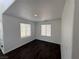 Bright, clean bedroom featuring dark floors, neutral walls, and plenty of natural light at 5661 Bonds Flat St, Las Vegas, NV 89148